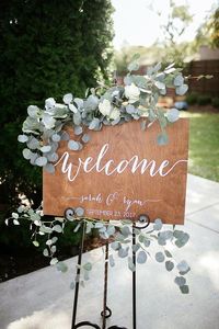 greenery garland decorated wedding sign board