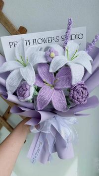 Crochet flower bouquets are perfect for adding a touch of elegance and charm to any occasion. Whether it's a wedding, a baby shower, or simply to brighten up your home decor, this stunning arrangement of lily, rose, and hyacinth in purple and white is sure to impress.  To start, gather the necessary materials, including a crochet hook, yarn in purple and white shades, stuffing, and floral wire. Begin by crocheting the lily, using white yarn for the petals and yellow for the stamen. Then, move on to the rose, using purple yarn for the petals and green for the stem. Finally, create the hyacinth, using a combination of purple and white yarn for the petals and green for the stem.  Once all the flowers are crocheted, stuff them with some fiberfill to give them shape and dimension. Then, atta