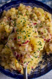 Take your potato salad to new heights with this easy and delicious Austrian Potato Salad (Erdäpfelsalat). This vinegar based side features a bit of crunch and color from red onion and some added tanginess from mustard. Serve it with schnitzel or any other protein you like!