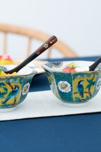 A set of 5 small Japanese kobachi bowls depicting peaches and birds in Yoshidaya style. Each piece is uniquely hand-painted by a dedicated artisan of Kutani ware, making the texture of the plate warm and appealing. It comes in a set of five bowls, so it is perfect for everyday use with the family as well as for parties with guests. | Visit MUSUBI KILN to see other authentic Japanese tableware.