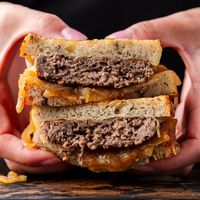 The Patty Melt is the iconic diner-style sandwich that combines ground beef patties, Swiss cheese, caramelized onions, and special sauce sandwiched between two slices of crispy grilled rye bread.