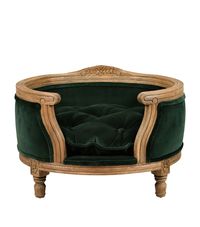 Allow your four-legged friend to relax in unrivalled comfort and sophistication with the George dog bed from Lord Lou. Boasting aplush velvet cushion for curling up upon each night, this hand-crafted essential also showcases an ornate oak shell with intricately carved detailing, note how it is subtly raised from the floor, elevating the regal feel for its lucky owner.