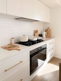 Modern cosy white kitchen with polytec blossom white cabinetry