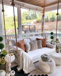 Fall front porch with rope swing with pillows via @mygeorgiahouse. A great way to decorate your front porch for autumn! More seasonal decor this way... #curatedinterior