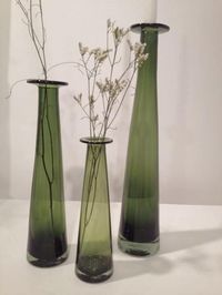 Translucent and in bold fresh color, these candleholders accommodate a standard taper and can be used for fresh or dried flowers or twigs. Grouped together or by itself, our candleholders make a great artistic statement!