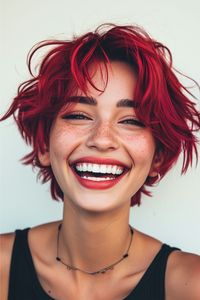 This electric crimson crop is a statement of boldness and fun. The vibrant red shade exudes confidence and radiates energy. It's a color that commands attention and celebrates a bold personality. Click here to see more stunning red hair color ideas.