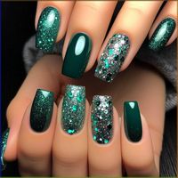 Most nails are painted with a deep, luxurious emerald green polish. The ring fingers feature a striking glitter accent, combining emerald and silver glitter for a dazzling effect. The glitter is densely packed, creating a sparkling contrast against the solid emerald nails. The overall look is glamorous and eye-catching.