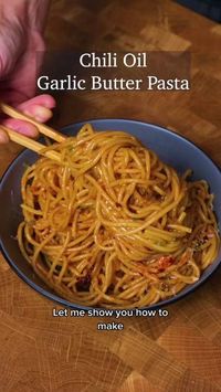 200g of spaghetti * ﻿﻿5 garlic cloves, minced * ﻿﻿1.5 tbsp of butter * ﻿﻿2 tbsp of chili oil * 2 tbsp of honey * ﻿﻿2 tbsp soy sauce * A splash of pasta water * ﻿﻿40g of grated parmesan * ﻿﻿Chives, minced To garnish: * 1 egg (optional) - to make it more creamy * Parmesan cheese * Chili Oil Steps: 1. Cook the pasta to al dente for about 10-12 minutes 2. Combine chili oil, honey, soy sauce, and hot pasta water for the sauce. Set aside. 3. Heat the butter in a pan. Then, add garlic and cook. Looking for more culinary delights? Dive into our bio and click the link!