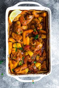 Portuguese chicken bake is filled with nutritious ingredients: chicken thighs, carrots, potatoes, onions and a delicious tomato sauce.