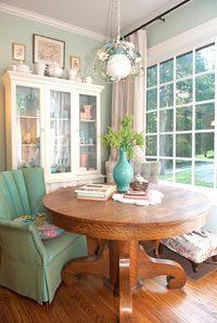 Cozy dining room painted in benjamin moore's prescott green.