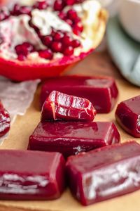 Chewy and soft pomegranate caramels are made with homemade pomegranate molasses and have a delightfully sweet and tangy flavor. These would make a perfect gift or holiday treat!