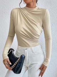 This elegant and stylish Ruched Slim Fit Bodysuit is perfect for any occasion. It features a plain pattern, with a belted, wrapped, and pleated design coming in a variety of colors. The fit is regular, with a shawl collar and long-sleeve design. The waistline is high, making it a great choice for adding a touch of sophistication to your look. Whether you are at work or on a night out, this shirt will ensure you look your best. Specifications: Style: Elegant Pattern Type: Plain Details: Belted, w