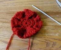 How to stitch a knit or crochet flower brooch. How To Crochet A Poppy To Sell For Charity - Step 4