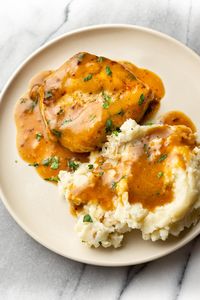 Love ranch seasoning? This recipe uses it to make the best sauce/gravy for pork chops. These ranch pork chops are quick and easy!