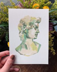 "This set of 5 x 7's is a tasteful rendition of Greek Bust Statues. The heads have subtle green, grey, and beige coloring -that will complement any situation they're hung in. Hang them as separate entities or together. **Statue of David & Head of Youth** Signed by the artist for authenticity.  >>Matching stickers: Dave: https://www.etsy.com/BohoBrain/listing/1018860743/greek-bust-statue-vinyl-sticker-david?utm_source=Copy&utm_medium=ListingManager&utm_campaign=Share&utm_term=so.lmsm&share_time=1