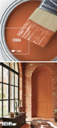 Snuggle up to the warm and cozy style of Civara by BEHR® Paint. This bright red-orange color comes together with exposed brick walls, plenty of natural light, dark wood furniture, and a cowhide rug to create this open and welcoming space. How will you use this colorful paint shade in your home? Click below for more inspiration. by Makia55