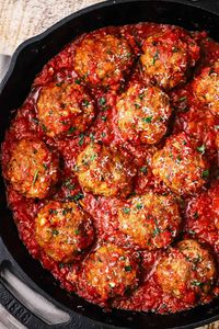 Homemade Italian Meatballs are the quintessential Italian-American culinary delight. Perfect over pasta, as an appetizer, or in cheesy sub sandwich. Deeply flavorful and always a hit!