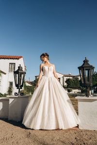 This Stella York ball gown has all over shimmering details and a basque waist. This princess wedding dress is now available to try on in New Jersey!