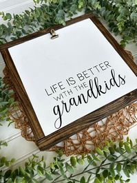 Created with hand-cut and sanded solid wood, this hand painted and framed sign is sure to be the perfect addition to your home decor! The photo clip can hold you precious memories and is easily switched out. A perfect high quality gift for Grandparent's Day, Christmas, or any occasion! Please note that no two products will be exactly alike due to the handmade nature of the wood and product. All items are made to last with high-quality and sturdy materials. 11"x11" White Background Black Letterin