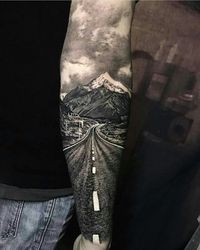 This tattoo is truly AMAZING! So artistic! Scenery tattoo. If I could be guaranteed a tattoo to turn out like this there'd be no going back. WOW Mountains tattoo, Open road tattoo. #IWish Baddass Tattoo