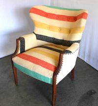 Antique chair with Pendleton style camp blanket upholstery and nail head trim from MODERNHAUS