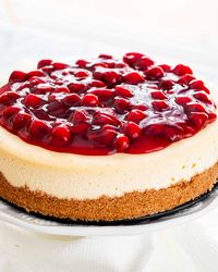 This Cheesecake Recipe is the only recipe you'll ever need for Cheesecake. A dreamy, decadent, rich, smooth and utterly delicious cheesecake topped with cherry topping! This really is what cheesecake dreams are made of! #cheesecake #recipe