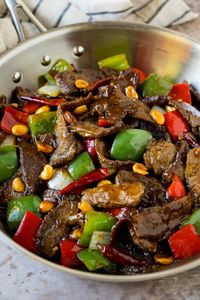 This kung pao beef is a combination of thinly sliced steak, bell peppers, onions and roasted peanuts, all in a savory and spicy sauce.