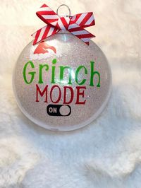 Grinch Inspired Christmas Ornament. Great Addition to your Christmas gift or the perfect gift! This ornament is made of plastic for children & Pet friendly. This is a single ornament. It's made with glitter and vinyl decal. Size is: 3.15in x 1.6in x 3.46in this is a flat disk ornament. Any questions or concerns message us. Thank you.