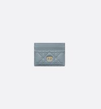 The Dior Caro Freesia card holder presents an elegant and practical style. Crafted in cloud blue supple calfskin with Cannage stitching, it is embellished with the CD signature on the front. Featuring five card slots, the refined accessory will fit anywhere and can be paired with other Dior Caro creations..