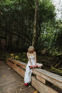 Senior photos on a bridge in redwoods