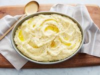 Ree's Creamy Mashed Potatoes : Butter, cream cheese, and heavy cream make these potatoes the richest ever.