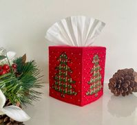 Handmade Christmas tree tissue box cover.  All four sides have a Christmas tree outlined in black on a red background with metallic gold thread that adds a little sparkle. Fits standard boutique size tissue box. Perfect for your home, office or as a gift for the holidays!