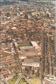 The photograph is dominated by Sheffield United's football ground at Bramall Lane. The church located behind the stadium is St Mary's Church on St Mary's Gate