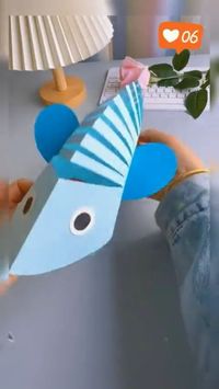 Creating a fish using a square piece of paper.