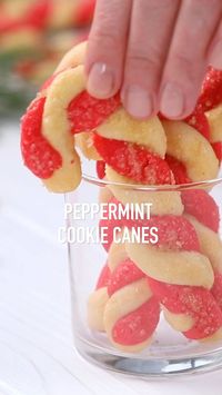 Peppermint Cookie Candy Canes - These #sugar #cookies look and taste like #candy canes. Two colors of sugar cookie dough are wrapped into a cane shape. Sprinkle with a touch of pure cane sugar just before baking for an extra sparkle. The perfect #dessert, #snack or #homemade #gift for the #holiday #season. Cute for a #kids #party. For more cookie, bar and brownie recipes visit www.imperialsugar.com. #imperialsugar #sugarcookie