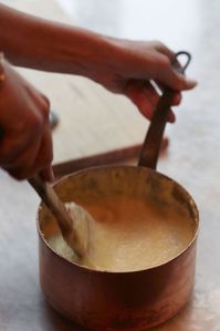 This produces a creamy polenta that is soft enough to spread on a board or plank, but will set up around the edges to contain any sauce you ladle on top.