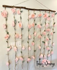 This floral piece is made with a 48” stick with floral vines that hang 30”