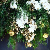 Hanging florals with warm light detail. | by Flower Jar