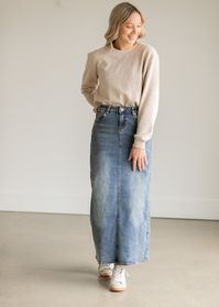 The perfect straight fit maxi denim skirt! The Kyra Long Denim Skirt is an Inherit Design tailored in a straight fit with amazing details. Made with a vintage wash it has an IC embroidered logo on the back pocket in the corner, criss-cross belt loops in the back, and is super stretchy! There is a back slit for maximum walkability! You're going to love styling this every which way for any season as this skirt will certainly be a wardrobe staple! Style: back slit, straight fit, contrast stitching