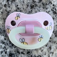 Note: All of our hand made reborn magnetic pacifiers use the N pole of the magnet. This way our pacifiers will always attach to the same pole. Only while supplies last. Many pacifiers are seasonal and cannot be restocked. Prices range from $3.95 and up. GIDH = Glow in the Dark Handle All pacifiers are NB size unless noted - PR = Preemie, B = 3-9mth, T = Toddler Only choices in the drop down are available at this time. Each pacifier sold separately. Includes the altered pacifier (a strong magnet