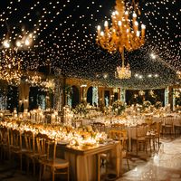 Turn your wedding reception into a fairytale with this breathtaking decor featuring twinkle lights and opulent chandeliers. The combination of soft candlelight, golden accents, and lush florals creates a magical ambiance, perfect for a truly unforgettable celebration. Ideal for evening weddings, this setup adds a sense of grandeur and elegance to any venue. Save this pin for inspiration on crafting a dreamy and luxurious wedding reception! #TwinkleLightWedding #WeddingReception #ElegantWeddings #ChandelierDecor #WeddingInspiration"