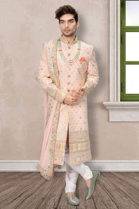 Rich as well as classy look in wedding function with this peach color georgette fabric sherwani. Nice features with thread, aabla and sequins stand collar, full buttoned placket and straight vented hem. Comes with matching bottom and dupatta.