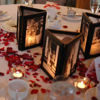 AWESOME IDEA !! ... Picture frames glued together with no back and a flameless candle behind...illuminates the photos.