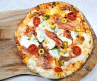 The best pizza made at home is born between the frying pan and the grill. Easy dough, basic toppings, thin crust; no pizza stone, no wood fired oven. Beats takeaway every time!