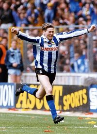 Legend: Chris Waddle shows off Sheffield Wednesday's classic kit