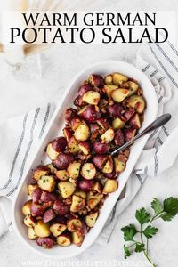 Warm German Potato Salad is a potato salad that can be enjoyed year round that is sure to be a family favorite. It's made with potatoes and bacon with a vinegar-based dressing.