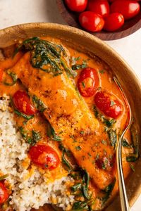 Crispy Salmon with Roasted Red Pepper Sauce is rich and decadent with perfectly cooked salmon and luxurious creamy sauce. Serve with rice!