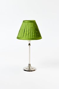 Marvelous hand-pleated silk shade. Similar lamps at La Grenouille in New York have illuminated dozens of lovely swans with a flattering glow. Fern green to span the seasons. Collect other colors to change the mood. 6”d x 4.5”h Made to fit our Table Lamp Bases, sold separately. Use with a battery-operated tea light. Pair with other treasures from our unique and elegant lighting collection.