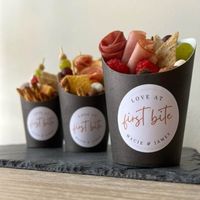 Everyone loves these Wedding Charcuterie Cups! Flirty and fun, they're the perfect size for a snack while partying at a reception. They're a great way to get people talking at your next high-end bridal event, be the first to have them at your party!. Each set includes twenty 2" custom printed seals "Love at First Bite!" We will Personalize with your names- just leave them at checkout. Our seals are printed on recycled white labels with commercial grade laser print equipment to ensure crisp clari