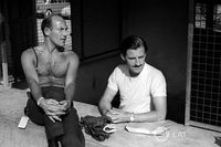 Graham Hill, BRM talks with Stirling Moss